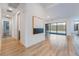 Hallway featuring wood floors with a view of the backyard swimming pool at 477 Highview Ridge Ave, Las Vegas, NV 89138