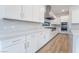 Modern kitchen with white cabinets, stone countertops, stainless steel appliances, and gas range at 477 Highview Ridge Ave, Las Vegas, NV 89138