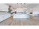 Open-concept kitchen features stainless steel appliances, large island, and pendant lighting at 477 Highview Ridge Ave, Las Vegas, NV 89138