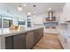Open kitchen design with a large center island, stainless steel appliances and light fixtures at 477 Highview Ridge Ave, Las Vegas, NV 89138