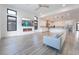 Open-concept living room flows to kitchen, featuring fireplace, sleek fan, and modern finishes at 477 Highview Ridge Ave, Las Vegas, NV 89138