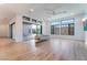 Bright living room featuring large windows, recessed lighting, and wood-style floors at 477 Highview Ridge Ave, Las Vegas, NV 89138