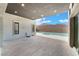Covered outdoor patio with mountain views offers a serene retreat, complemented by a sleek pool and spa at 477 Highview Ridge Ave, Las Vegas, NV 89138