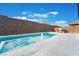 Beautiful pool and spa with integrated fountain feature, set against a backdrop of lush landscaping at 477 Highview Ridge Ave, Las Vegas, NV 89138