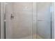 Bathroom shower featuring tiled wall and glass doors at 477 Highview Ridge Ave, Las Vegas, NV 89138