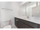 Clean bathroom featuring modern fixtures, lots of counter space, and white tile floors at 4915 Chidlaw Ave # 2, Las Vegas, NV 89115