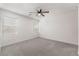 Bright bedroom featuring plush carpet, a modern ceiling fan, and natural light at 4915 Chidlaw Ave # 2, Las Vegas, NV 89115