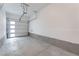 Clean, empty garage with a white door and an automatic opener, ready for parking and storage at 4915 Chidlaw Ave # 2, Las Vegas, NV 89115