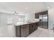 Open-concept kitchen with stainless appliances, large island, and access to the outdoor space at 4915 Chidlaw Ave # 2, Las Vegas, NV 89115