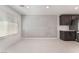 Bright living area with tile flooring, a textured accent wall, and access to the kitchen at 4915 Chidlaw Ave # 2, Las Vegas, NV 89115