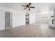 Open living area with vinyl flooring, fireplace, and access to kitchen and bathroom at 4980 Becky Pl, Las Vegas, NV 89120