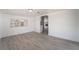 Spacious living room featuring hardwood flooring, natural light, and open floor plan at 4980 Becky Pl, Las Vegas, NV 89120
