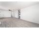 Spacious living room showcasing vinyl floors, ceiling fan and access to other rooms at 4980 Becky Pl, Las Vegas, NV 89120
