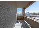 An exterior view of an open balcony with a concrete floor and wrought iron railing at 5040 S Rainbow Blvd # 201, Las Vegas, NV 89118