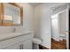 Bright bathroom with a vanity, quartz countertop, toilet and access to the shower at 5065 Atherton St, Las Vegas, NV 89120