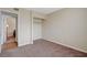 Bedroom with carpet showing open closet and door leading to adjacent room at 5065 Atherton St, Las Vegas, NV 89120