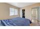 Comfortable bedroom features a window for natural light and a closet for storage at 5065 Atherton St, Las Vegas, NV 89120