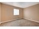 Neutral bedroom with carpet, baseboards, and a window with blinds at 5065 Atherton St, Las Vegas, NV 89120