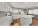 Bright and airy kitchen with white cabinets, center island, and modern appliances at 5065 Atherton St, Las Vegas, NV 89120
