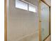 Shower with gold trim and small window at 5065 Atherton St, Las Vegas, NV 89120