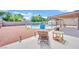 Spacious backyard with a covered patio, pool, and ample seating areas at 5376 Hillsboro Ln, Las Vegas, NV 89120