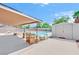 Backyard featuring a pool, patio, storage shed, and lush landscaping at 5376 Hillsboro Ln, Las Vegas, NV 89120