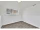 Finished basement featuring wood-look floors and a window at 5376 Hillsboro Ln, Las Vegas, NV 89120