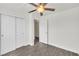 Bedroom featuring a ceiling fan and a closet with sliding doors at 5376 Hillsboro Ln, Las Vegas, NV 89120