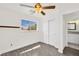 Bedroom showcasing a window, closet, and view of an attached bathroom at 5376 Hillsboro Ln, Las Vegas, NV 89120