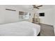 Bedroom featuring a ceiling fan, dresser, and a window for natural light at 5376 Hillsboro Ln, Las Vegas, NV 89120
