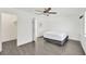 Bedroom with sleek gray flooring and a modern, minimalist design at 5376 Hillsboro Ln, Las Vegas, NV 89120
