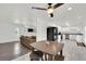 Open concept layout with dining area flowing into living room and updated kitchen at 5376 Hillsboro Ln, Las Vegas, NV 89120