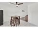 Bright dining area with tiled floors featuring a table with seating and ceiling fan at 5376 Hillsboro Ln, Las Vegas, NV 89120