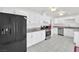 Bright kitchen featuring white cabinets, granite countertops, and modern stainless steel appliances at 5376 Hillsboro Ln, Las Vegas, NV 89120