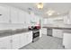 Spacious kitchen with tiled floor, white cabinets, stainless steel appliances, and granite countertops at 5376 Hillsboro Ln, Las Vegas, NV 89120