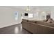 Comfortable living space offering hardwood floors and bright lighting fixtures at 5376 Hillsboro Ln, Las Vegas, NV 89120