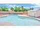 Large in-ground pool with seating, surrounded by mature trees, providing a serene outdoor oasis at 5376 Hillsboro Ln, Las Vegas, NV 89120