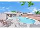 Sparkling in-ground pool with pool-side seating, perfect for enjoying sunny days and outdoor gatherings at 5376 Hillsboro Ln, Las Vegas, NV 89120