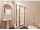 Bathroom featuring a glass-enclosed shower and pedestal sink at 5932 Lamotte Ave, Las Vegas, NV 89141