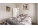 Inviting bedroom with a patterned quilt and neutral decor at 5932 Lamotte Ave, Las Vegas, NV 89141