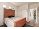 A bedroom displays light colored walls, trim, and an antique bed with wood floors at 5932 Lamotte Ave, Las Vegas, NV 89141
