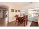 Cozy dining area features a wooden table with chairs, neutral walls and views of the neighborhood at 5932 Lamotte Ave, Las Vegas, NV 89141