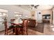 Open dining and living area with wooden table, chairs, and views of the neighborhood at 5932 Lamotte Ave, Las Vegas, NV 89141