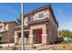 A charming two-story house with a terracotta-tiled roof and colorful shutters, complemented by desert landscaping at 5932 Lamotte Ave, Las Vegas, NV 89141
