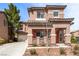 Inviting two-story home featuring a neutral color palette, well-kept landscaping, and a spacious driveway at 5932 Lamotte Ave, Las Vegas, NV 89141