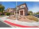 A charming two-story house with a terracotta-tiled roof and colorful shutters, complemented by desert landscaping at 5932 Lamotte Ave, Las Vegas, NV 89141