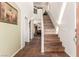 Bright foyer featuring tile flooring, staircase, and open access to living areas at 5932 Lamotte Ave, Las Vegas, NV 89141