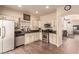 Bright kitchen with stainless steel appliances, granite countertops, and tile flooring at 5932 Lamotte Ave, Las Vegas, NV 89141
