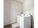 The laundry room is equipped with a washer, dryer, and wire shelving at 5932 Lamotte Ave, Las Vegas, NV 89141