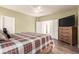 Comfortable main bedroom with wood floors, ensuite bathroom, and closet at 5932 Lamotte Ave, Las Vegas, NV 89141